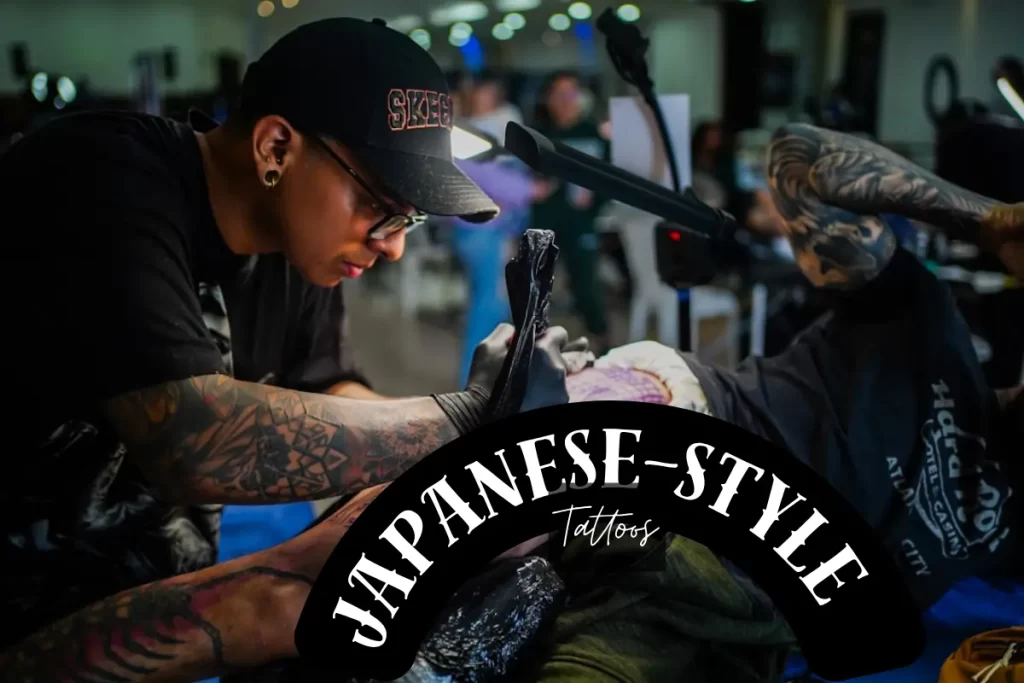  a tattoo srtist designing Japanese-Style Tattoos on a person's body